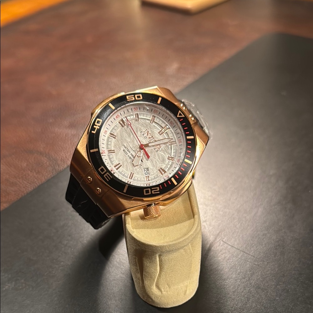 Gold and Black Watch with White Dial